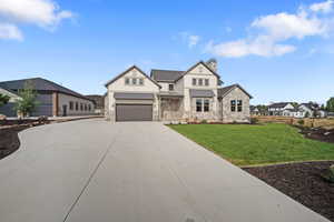 View of front of property with a front lawn