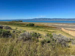 Property view of mountains with a water view