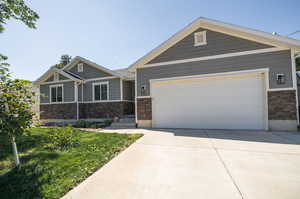 Craftsman-style home featuring a garage