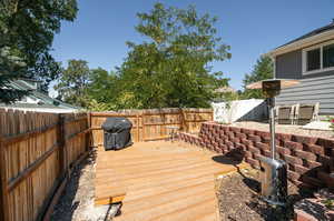 Wooden deck with a grill