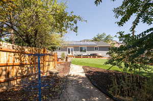 Exterior space with a lawn and solar panels