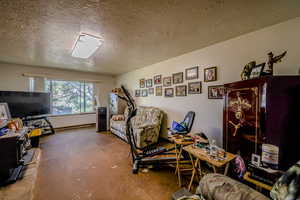 Bedroom featuring a textured ceiling