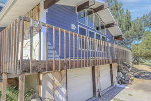 View of side of property with a garage