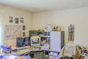 Office area with a textured ceiling