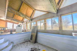 Interior space with plenty of natural light and vaulted ceiling