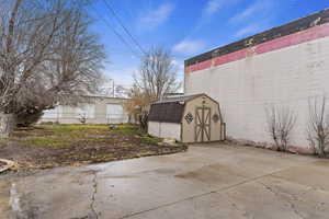 View of patio / terrace featuring a storage unit