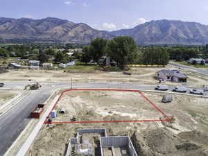 Birds eye view of property with a mountain view