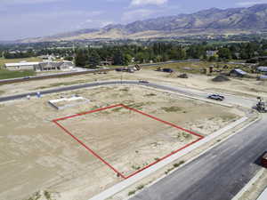 Birds eye view of property with a mountain view