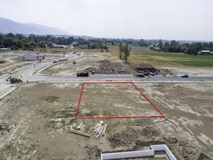 Birds eye view of property with a mountain view and a rural view