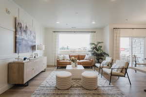 Living room featuring a healthy amount of sunlight and light hardwood / wood-style flooring