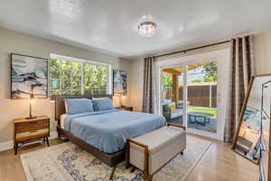 Primary bedroom: sliding glass doors exit to outdoor covered patio.