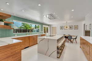 Left of the sink is an icemaker. Left faucet provides chilled water (forward) and boiling water (backward).