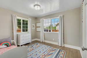 Bedroom 2 features hardwood floors and a large closet (not shown)