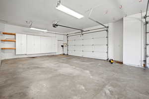 Garage featuring a garage door opener