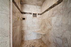 Master shower details with large custom tile.