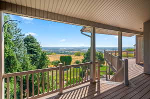 Wooden terrace featuring a rural view