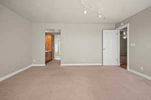 2nd bedroom with view of mountains and valley.  Attached to Jack and Jill bathroom. Carpeted and featuring ceiling fan