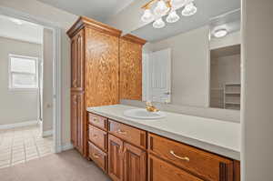 Bathroom featuring tile patterned floors and vanity