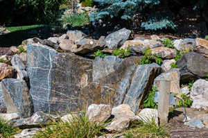 Relaxing waterfall in backyard.