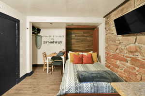 Bedroom featuring wood-type flooring