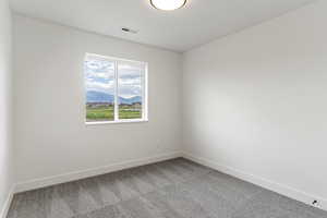 Carpeted spare room with a mountain view