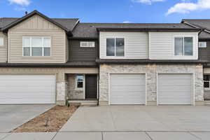 View of property with a garage