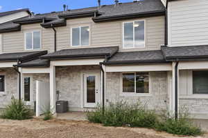 Back of house with cooling unit