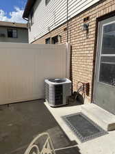 View of patio with central AC unit door just off kitchen,  walkout to   patio and huge common  area.