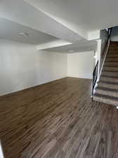 Family room featuring dark wood-type flooring and a textured ceiling