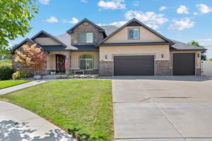 Craftsman-style home with a garage and a front yard