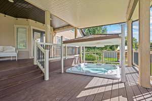 View of wooden terrace with hot tub