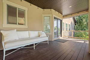 Wooden deck featuring outdoor lounge area