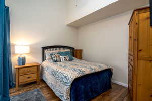 Bedroom featuring dark hardwood / wood-style flooring