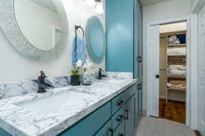 Bathroom with vanity and hardwood / wood-style floors