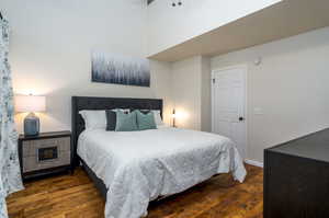 Bedroom featuring dark hardwood / wood-style flooring