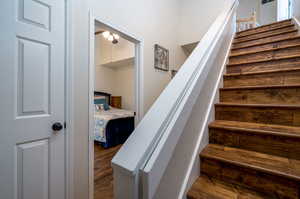 Staircase with hardwood / wood-style floors