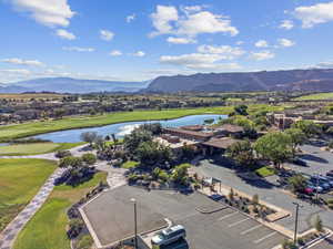 Birds eye view of property with a water and mountain view