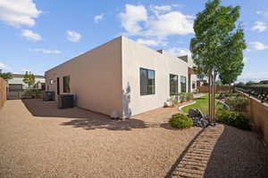 Back of house featuring central AC unit