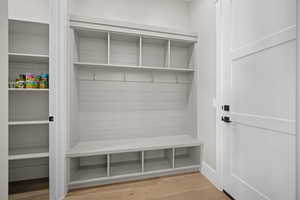 Mudroom with light hardwood / wood-style flooring