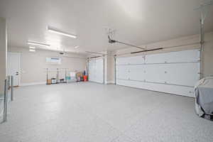 Garage featuring a wall unit AC