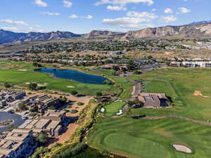 Drone / aerial view with a water and mountain view