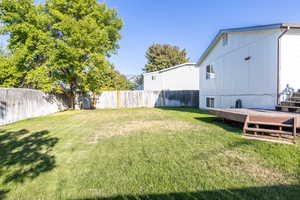 View of yard with a deck