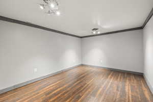 Bonus room with dark wood-type flooring