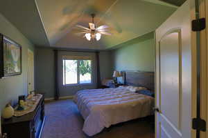 Carpeted bedroom with ceiling fan