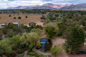 Bird's eye view with a water and mountain view