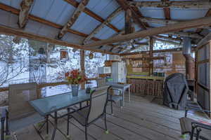 Snow covered deck featuring ceiling fan