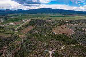 Birds eye view of property featuring a mountain view and a rural view