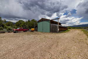 View of outbuilding with a mountain view