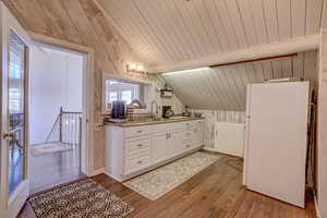 Bathroom featuring wooden ceiling, vanity, lofted ceiling with beams, and hardwood / wood-style floors