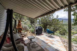 View of patio / terrace featuring a grill and a mountain view